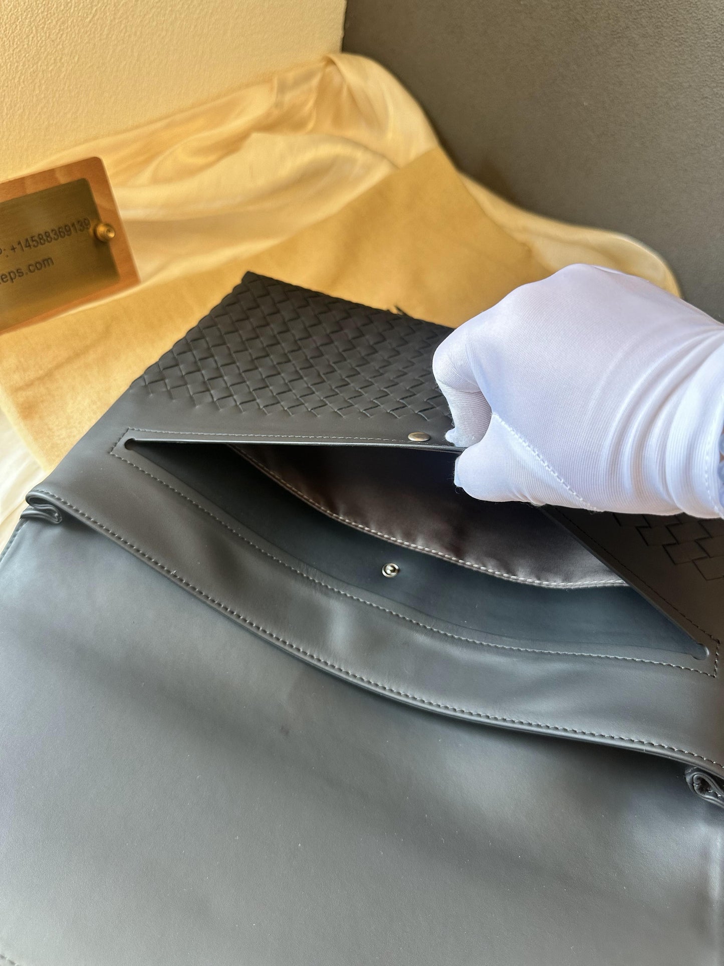 Bottega Veneta black leather mesh clutch bag
