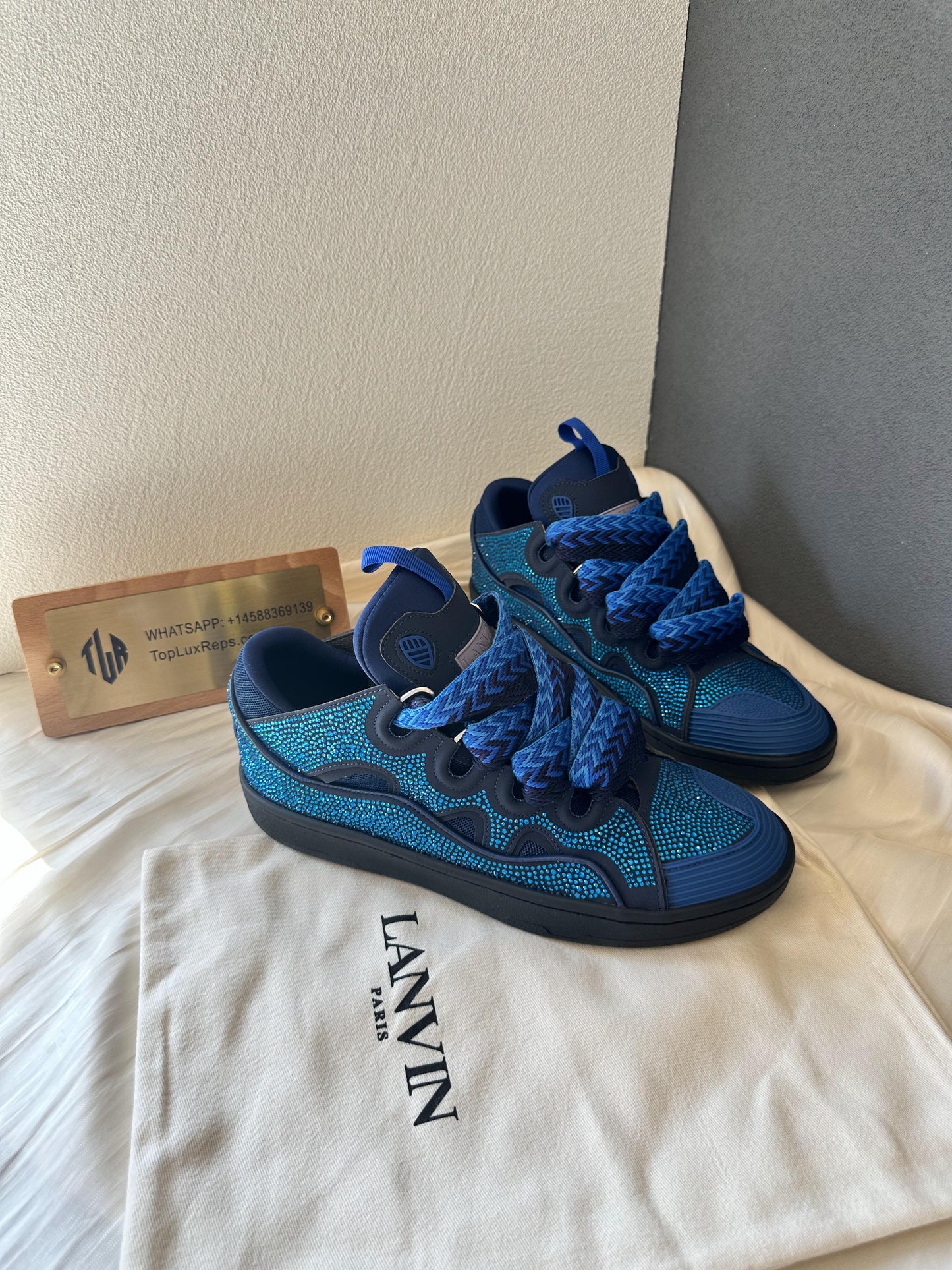 Lanvin curb sneakers in blue with rhinestone detailing