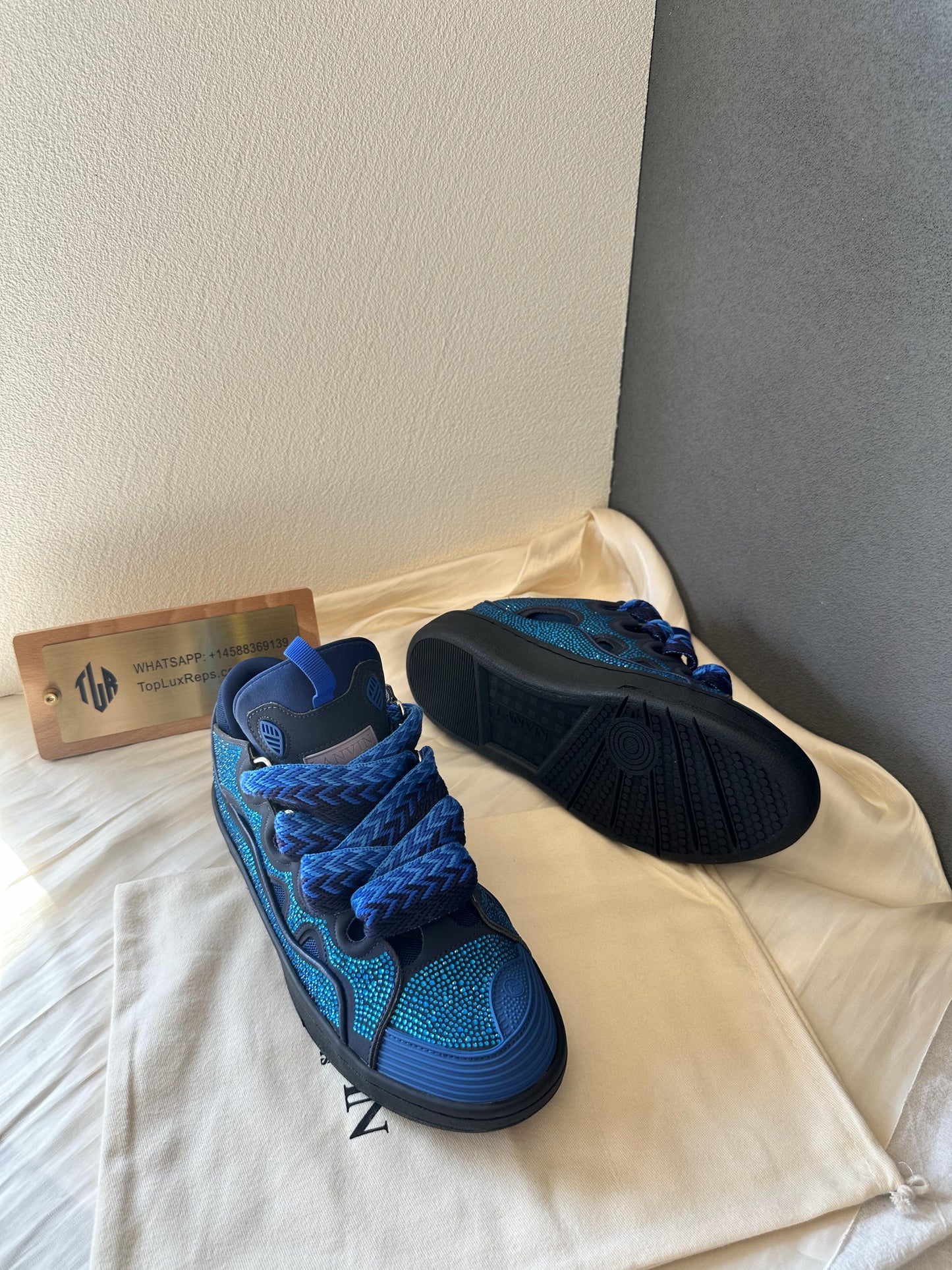 Lanvin curb sneakers in blue with rhinestone detailing