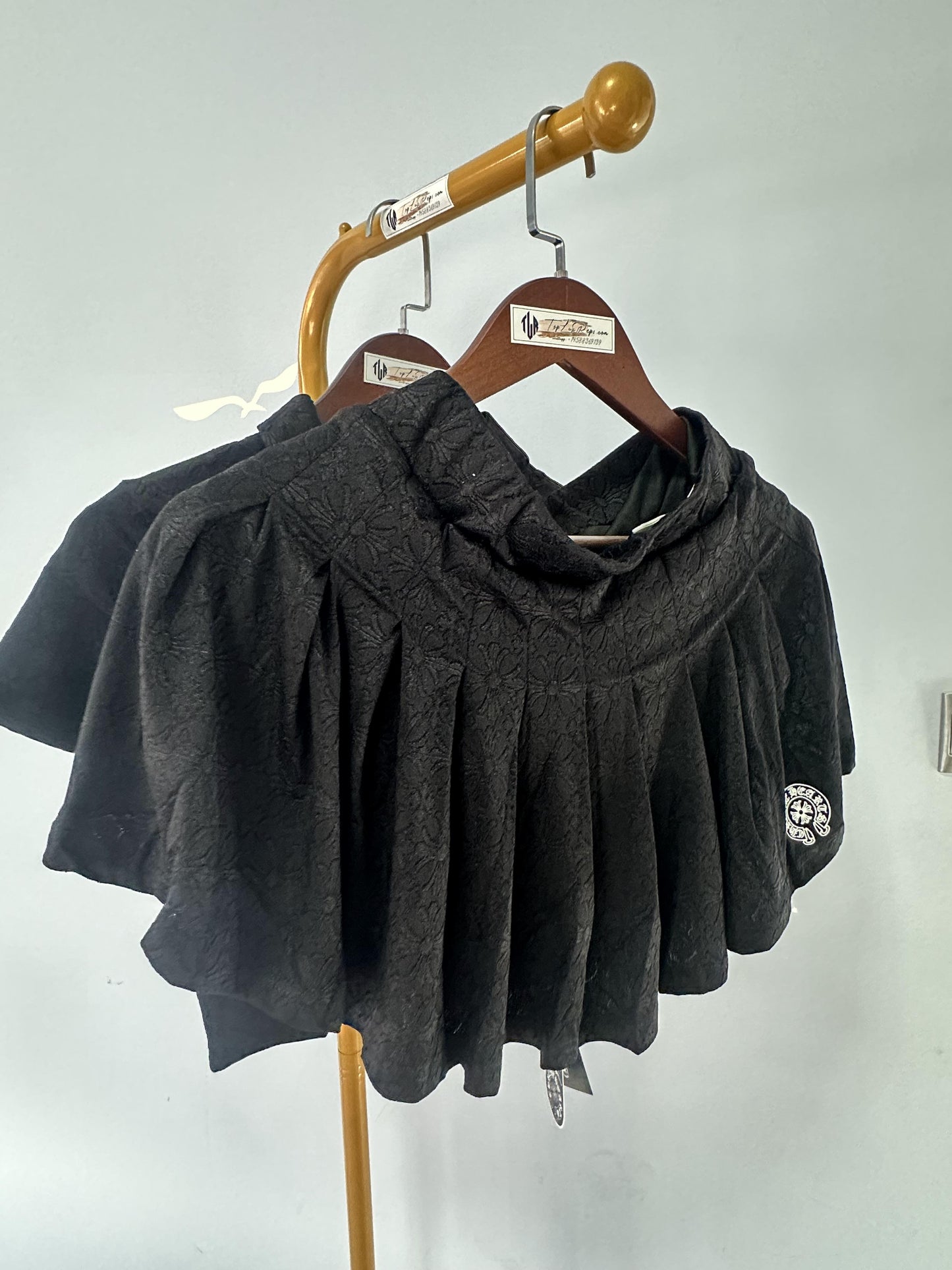 Chrome Hearts black embroidered polo crop top and pleated mini skirt set