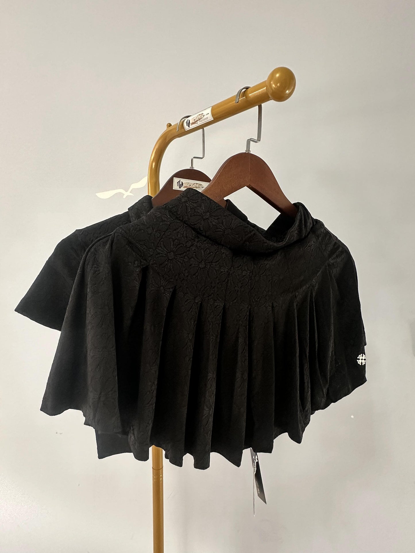 Chrome Hearts black embroidered polo crop top and pleated mini skirt set