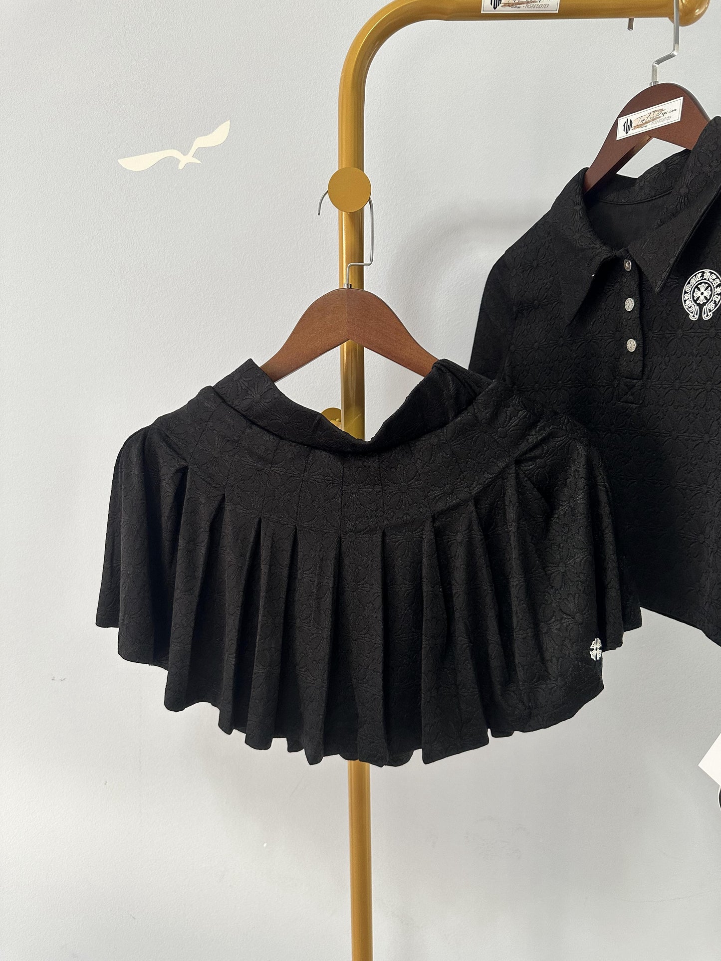 Chrome Hearts black embroidered polo crop top and pleated mini skirt set