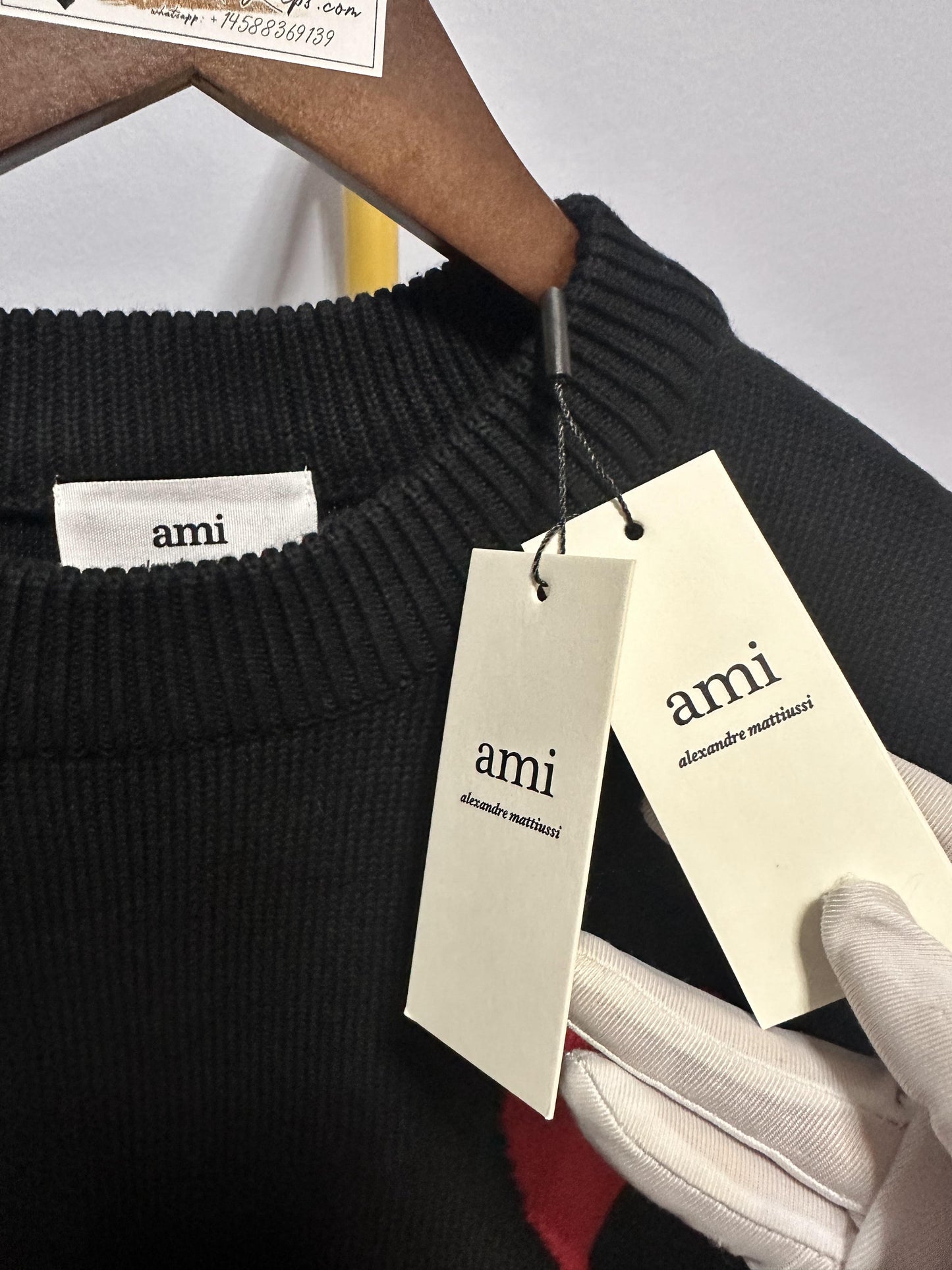 Ami heart embroidered black knit sweater - cozy pullover with signature red "A" logo