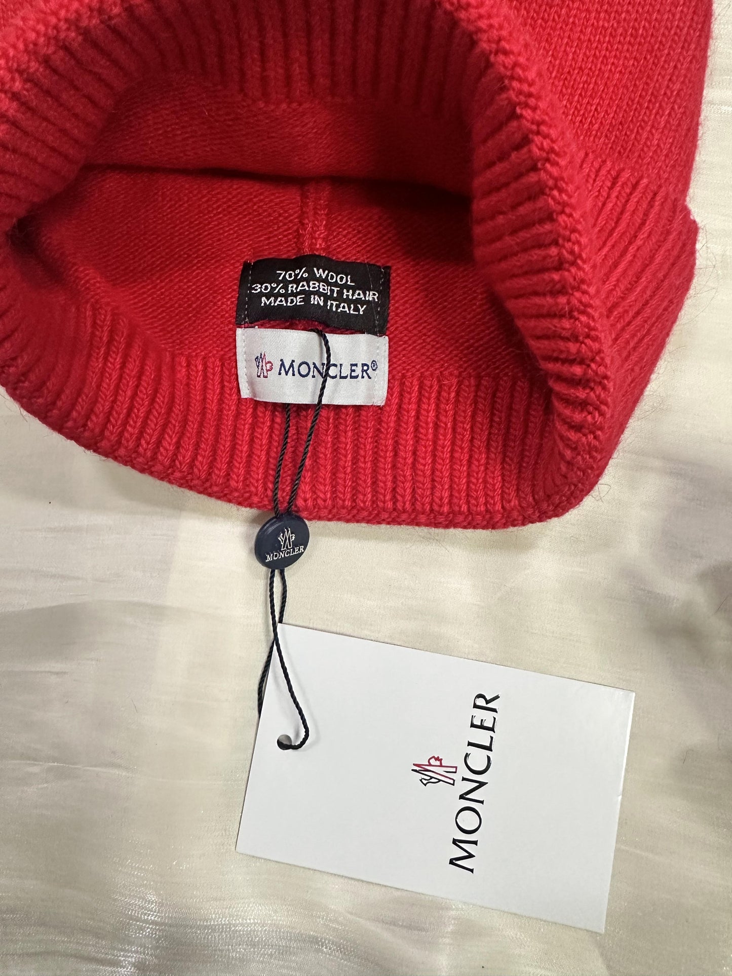 Moncler red wool beanie with iconic logo patch