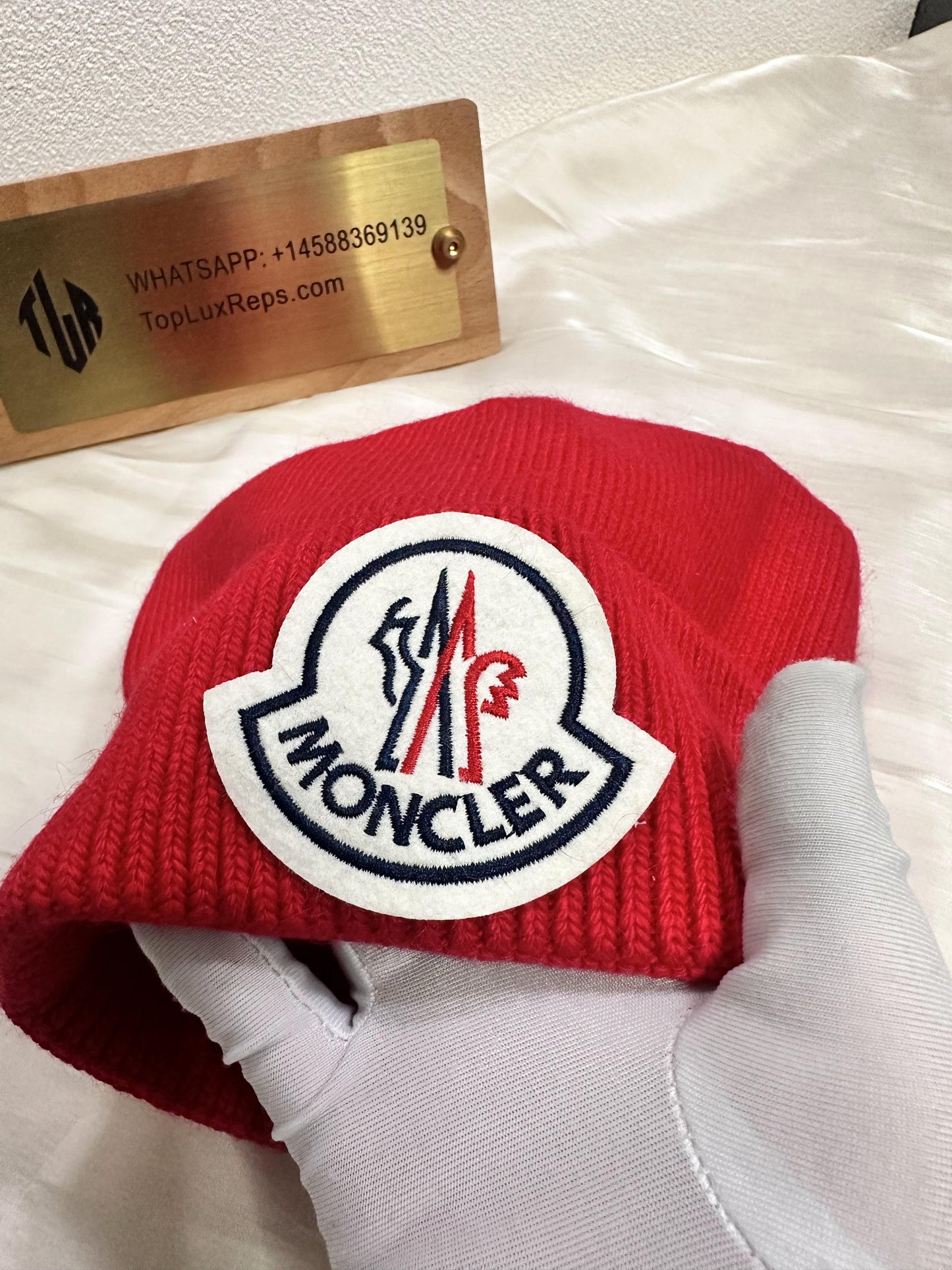 Moncler red wool beanie with iconic logo patch