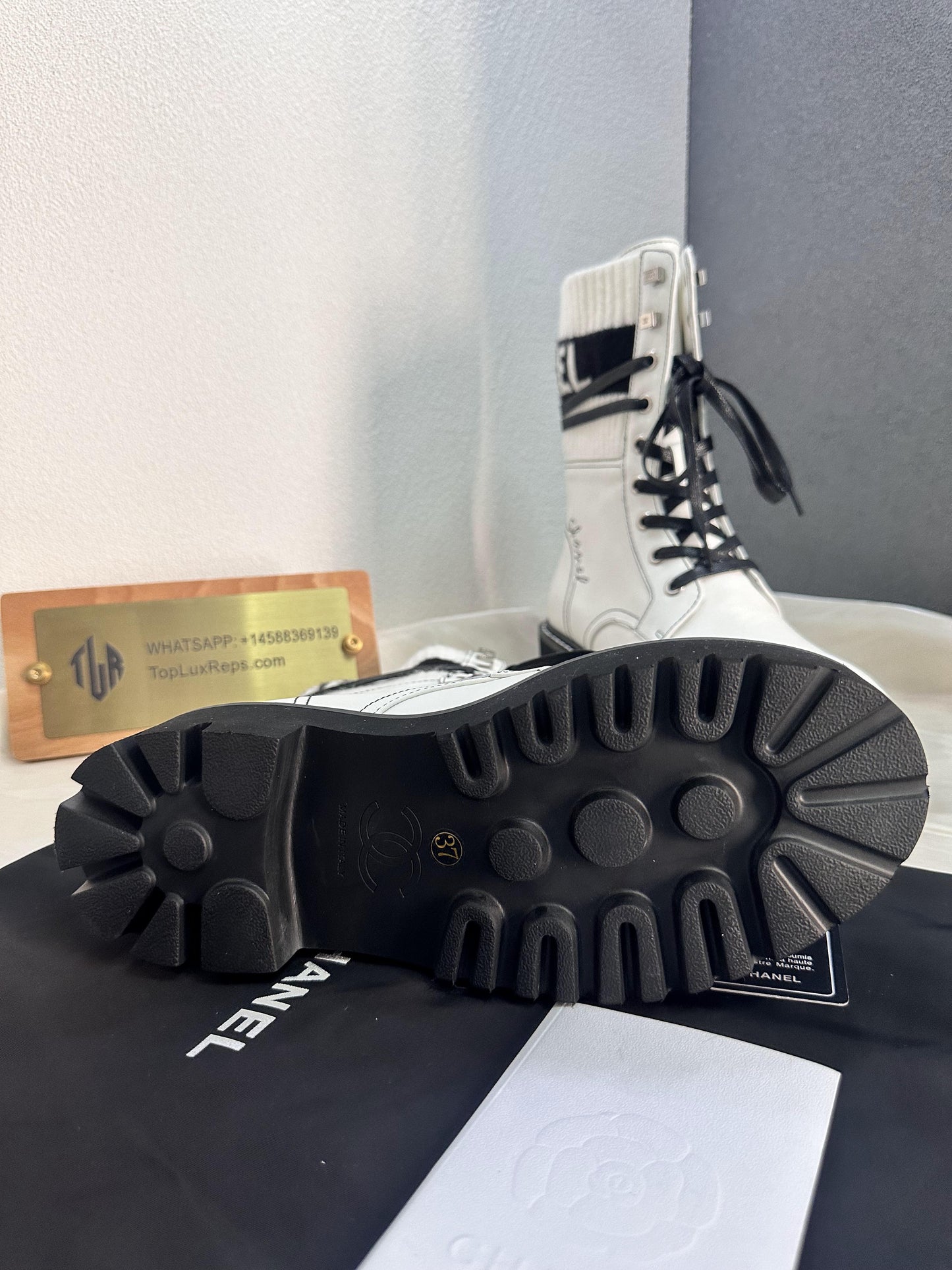Chanel white combat boots with ribbed knit logo socks