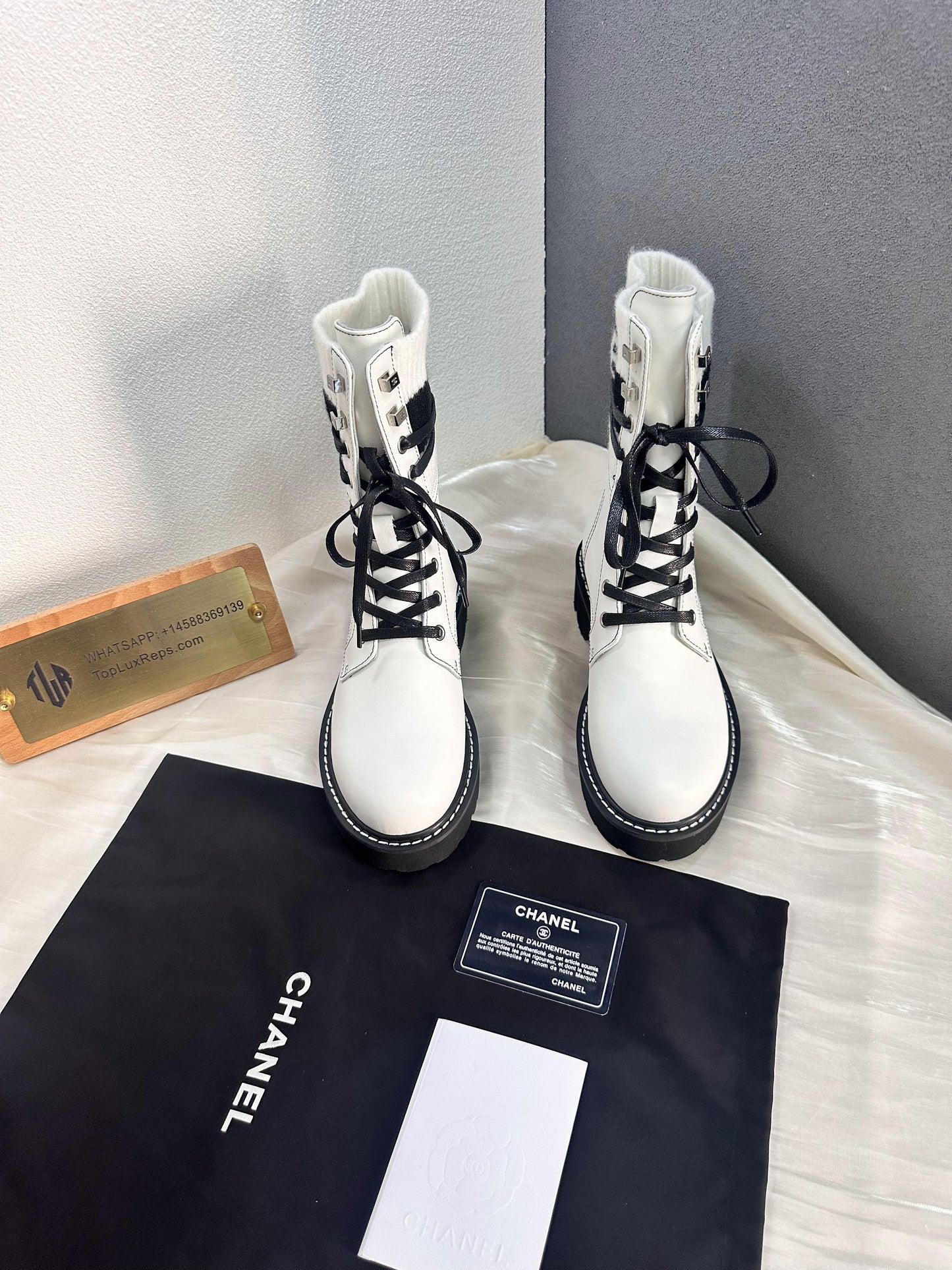 Chanel white combat boots with ribbed knit logo socks