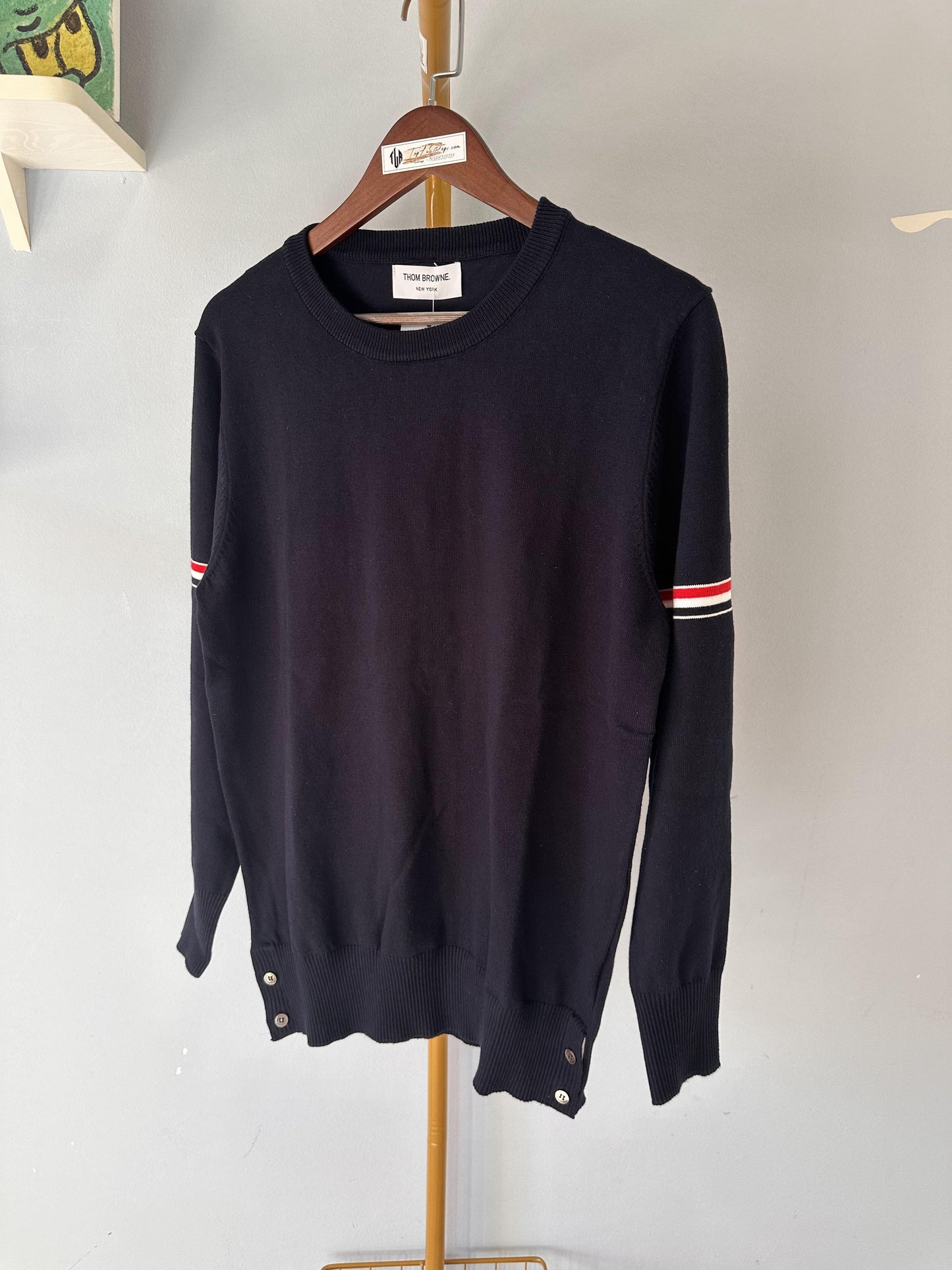 Thom Browne classic navy sweater with signature stripe detail