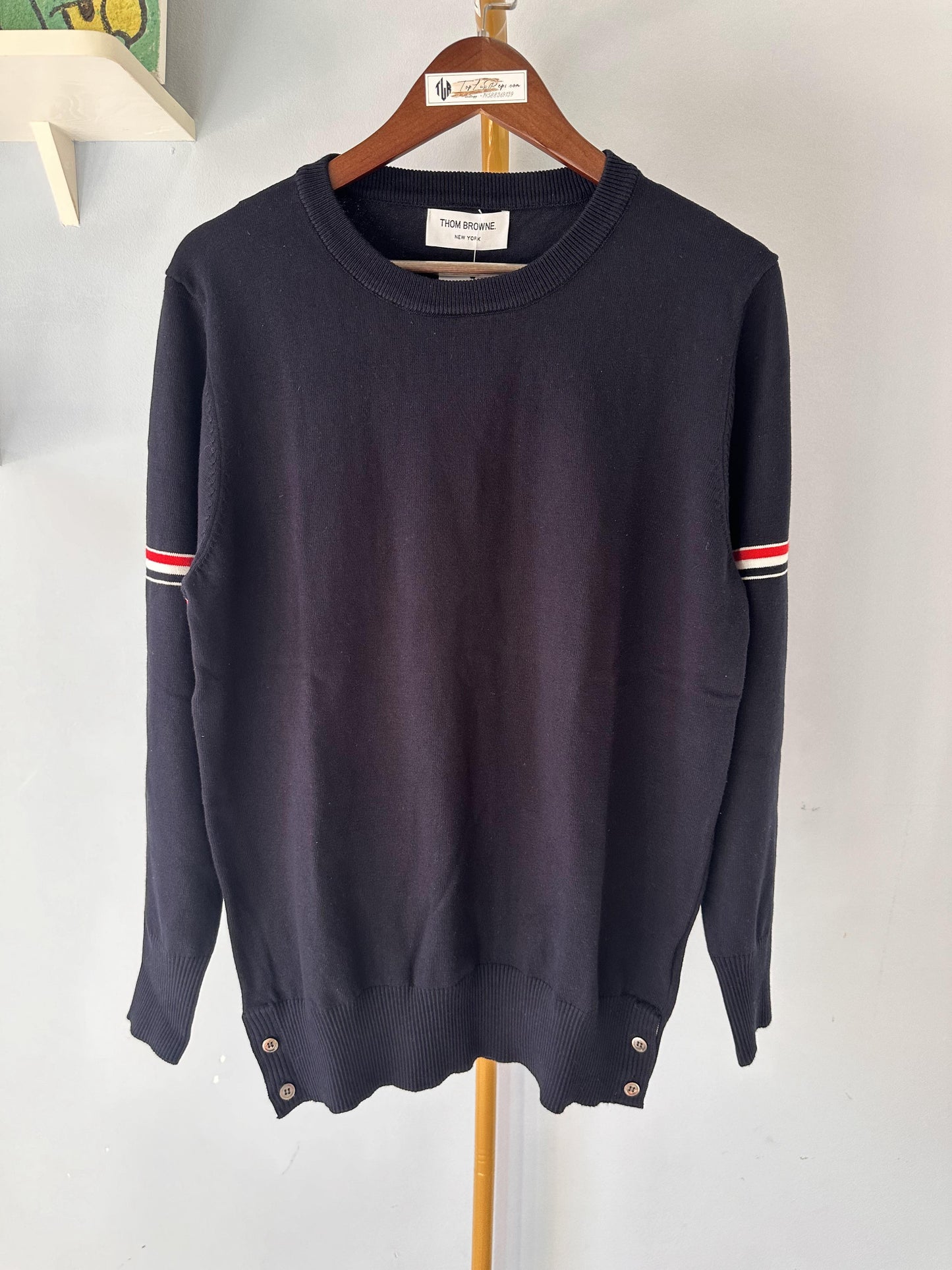 Thom Browne classic navy sweater with signature stripe detail