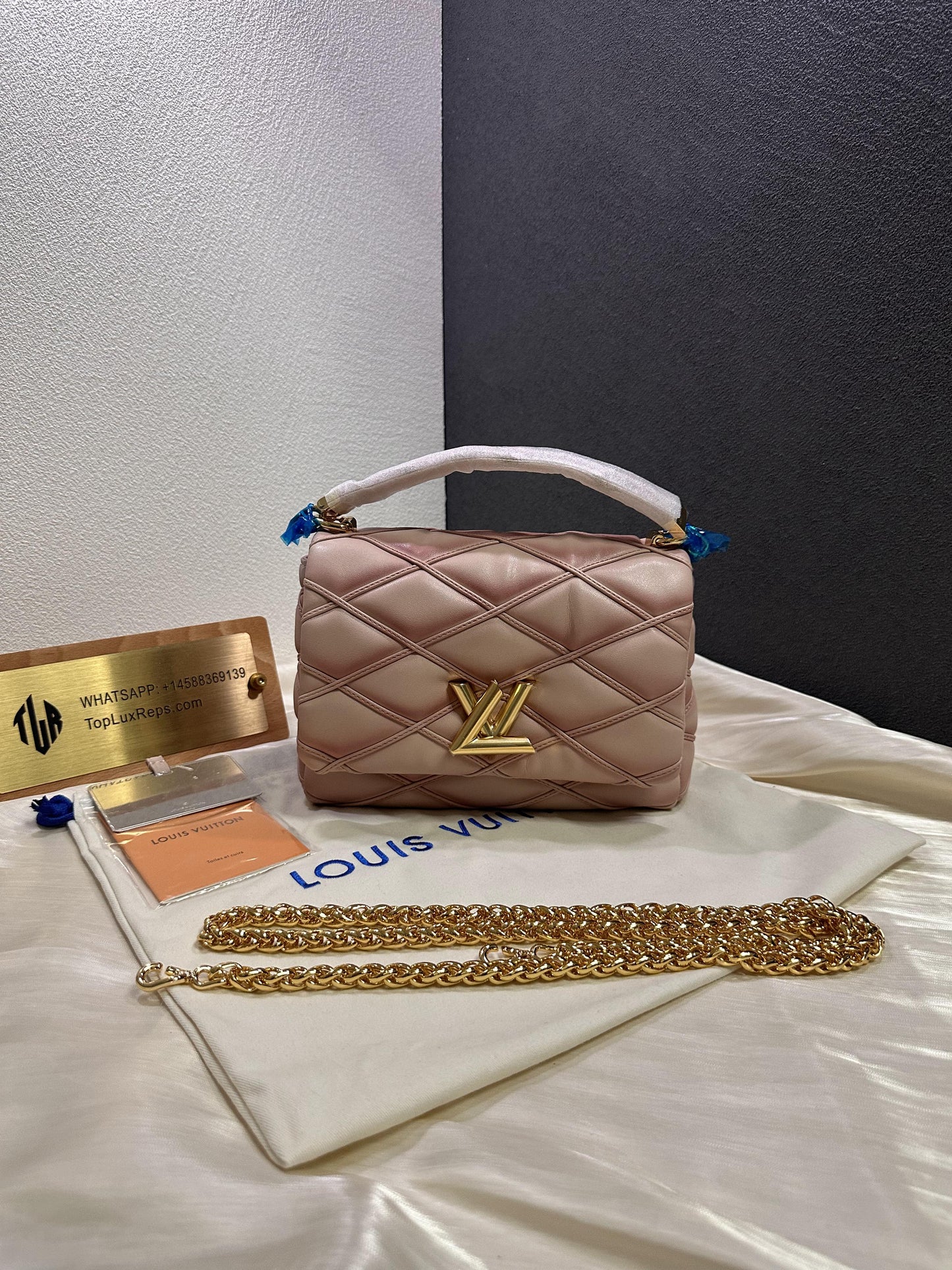 Title: Louis Vuitton New Wave Pink Quilted Leather Chain Bag with Gold LV Logo