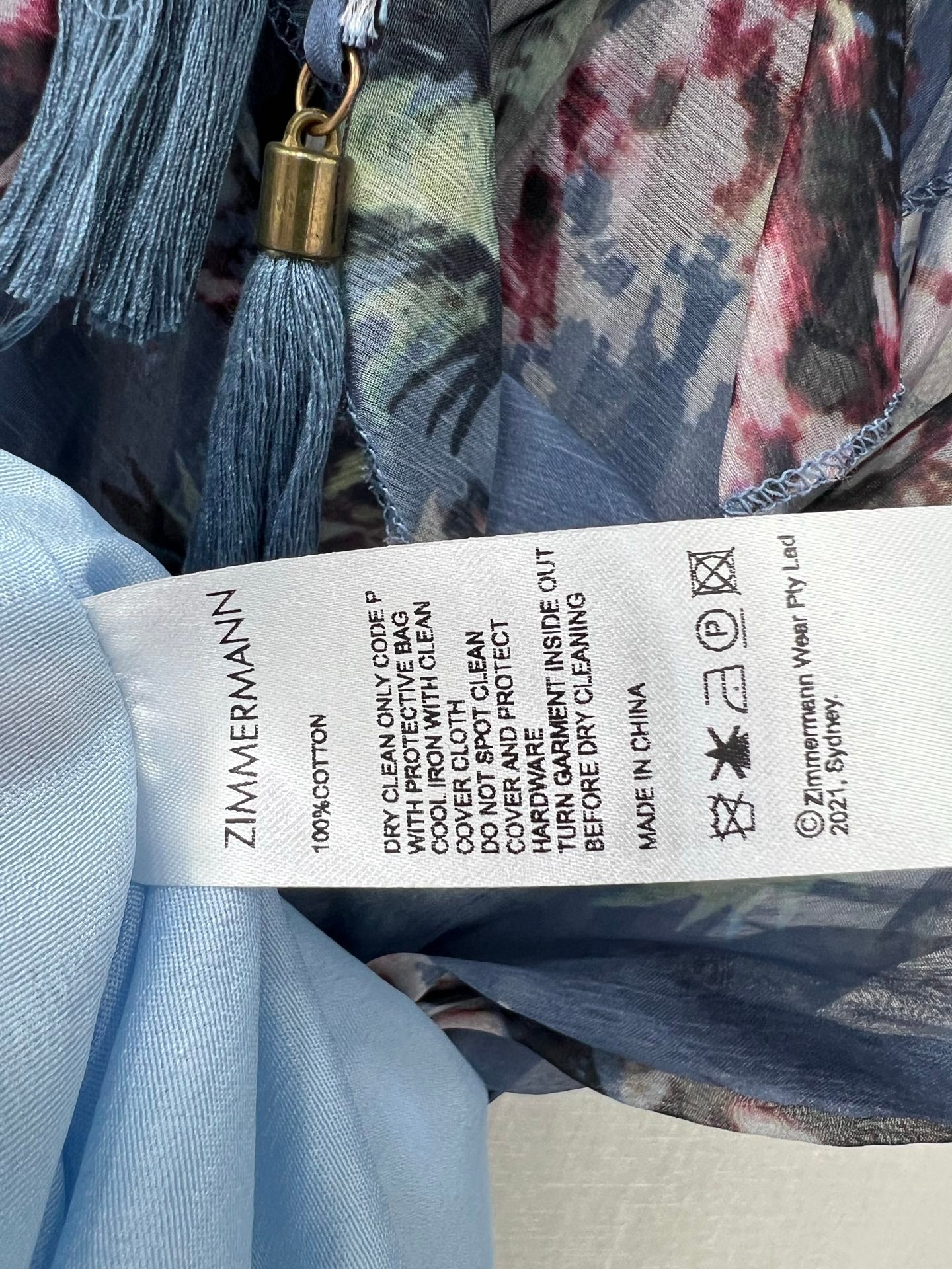 Robe courte à volants et fleurs bleues Zimmermann, col noué et manches lanternes