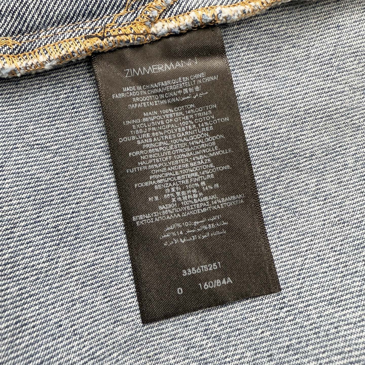 Robe en denim de coton délavé Zimmermann avec taille froncée et ourlet asymétrique