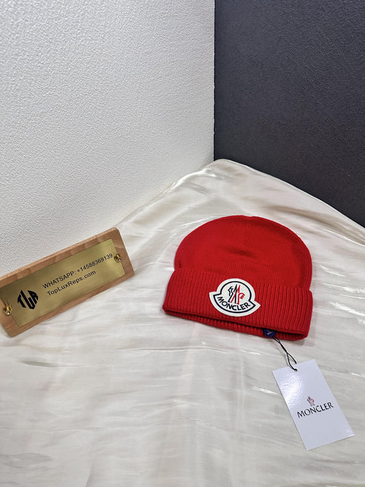 Moncler red wool beanie with iconic logo patch