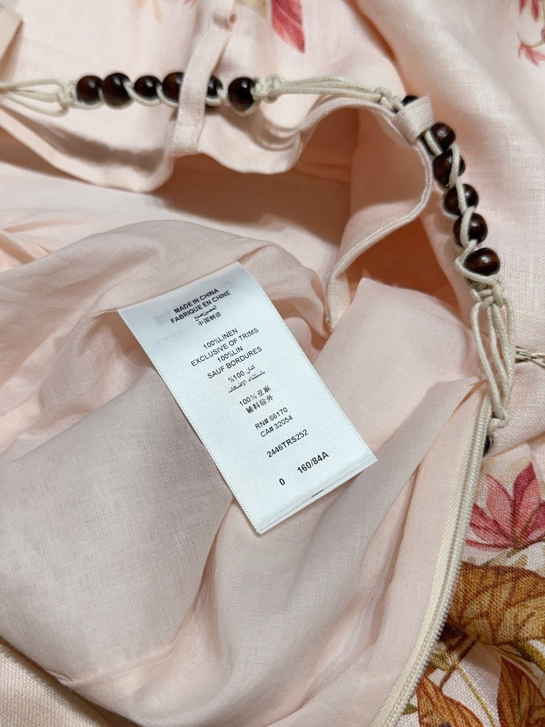 Short plissé en lin à imprimé palmiers Zimmermann – Crème florale